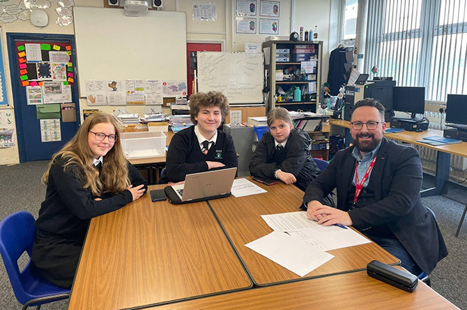 Caerphilly MS Hefin David with Bedwas High pupils Reggie Dovener, Nia Parsons, and Kaia Wells